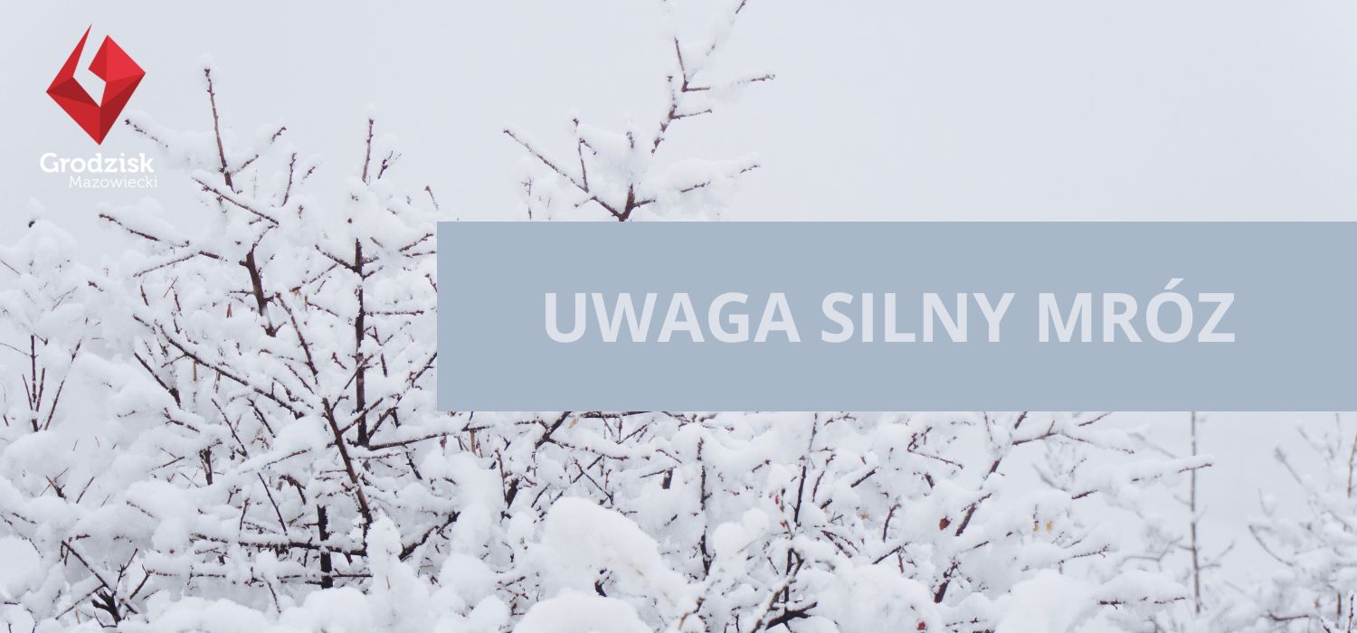 Zaśnieżone gałęzie drzewa na ciemnoszarym niebie z logotypem gminy Grodzisk Mazowiecki i tekstem UWAGA SILNY MRÓZ